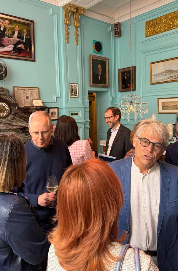 Guests at the Lunch at the Circle debate meeting for an aperitif in the bar before lunch